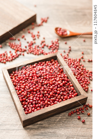 Red beans in a wooden box on a wooden board Red beans in a wooden box on a wooden board 117604845