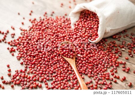 Red beans in cloth bag on wooden board 117605011