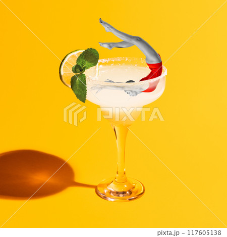 Poster. Contemporary art collage. Woman dive to glass of Margarita cocktail and swimming enjoying her rest. 117605138