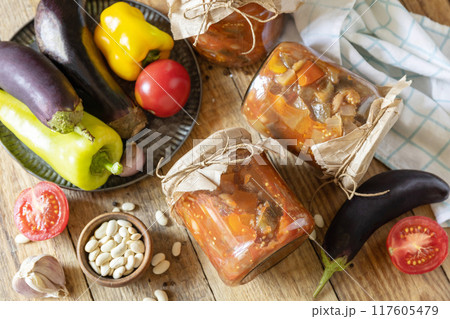 Healthy homemade fermented food. Salad eggplant with beanson a rustic table. Home economics, autumn harvest preservation. Healthy homemade fermented food. Salad eggplant with beanson a rustic table. Home economics, autumn harvest preservation. 117605479