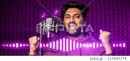 A man singing into a microphone with a purple background 117605774