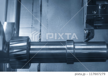 The  CNC lathe machine forming  cutting the metal shaft parts in the light blue scene. 117607279