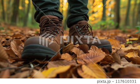 Hiking boots on a bed of autumn leaves. Hiking boots on a bed of autumn leaves. 117610331