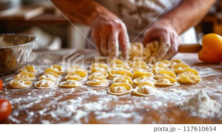 Making homemade pasta on wooden table. 117610654