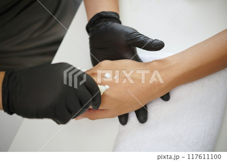 Applying Skincare Cream on Caucasian Person's Hand 117611100