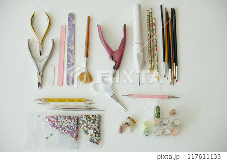 Assorted Nail Art Tools and Supplies Displayed on Table 117611133
