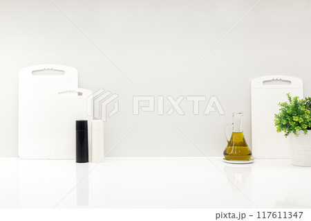 Cutting boards and utensils on white kitchen, mockup 117611347