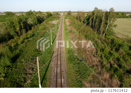 Railway through summer forest. Aerial view 117611412