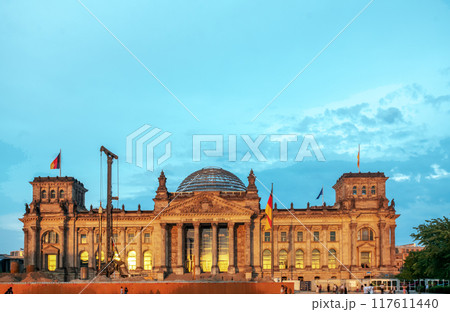 Reichstag building with reconstruction machines in warm sunset light! 117611440