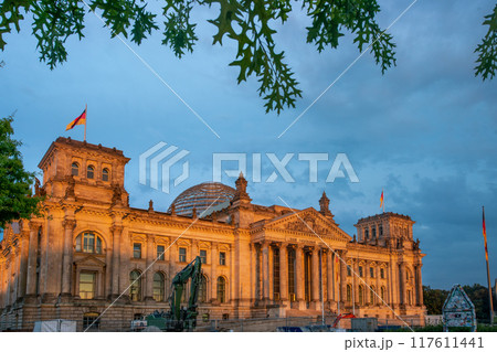 Reichstag building with reconstruction machines in warm sunset light! Reichstag building with reconstruction machines in warm sunset light! 117611441