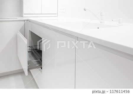Open kitchen drawer with metal dish dry rack Open kitchen drawer with metal dish dry rack 117611456
