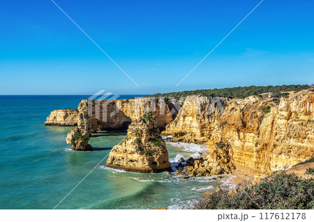 Praia da Marinha Beach among rock islets and cliffs seen from Seven Hanging Valleys Trail, Algarve, Portugal 117612178