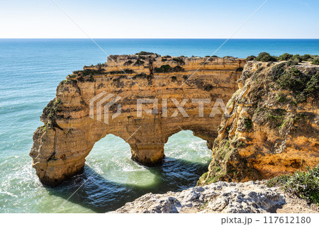 Praia da Marinha Beach among rock islets and cliffs seen from Seven Hanging Valleys Trail, Algarve, Portugal Praia da Marinha Beach among rock islets and cliffs seen from Seven Hanging Valleys Trail, Algarve, Portugal 117612180