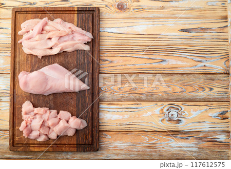 Raw chicken meat fillet ( breast ) Various of cutting in form slice and cube Raw chicken meat fillet ( breast ) Various of cutting in form slice and cube 117612575