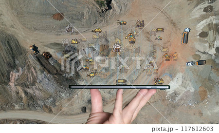 aerial view shot mining, dumpers, quarrying extractive industry stripping work. Big Mining Trucks. View from drone at opencast mining with lots of machinery trucks. High quality photo aerial view shot mining, dumpers, quarrying extractive industry stripping work. Big Mining Trucks. View from drone at opencast mining with lots of machinery trucks. High quality photo 117612603