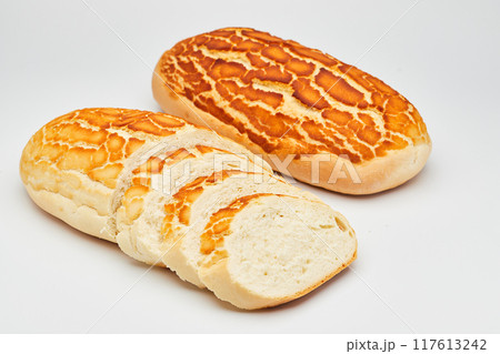 Freshly baked tiger bread loaf with crispy golden crust, perfect for sandwiches and toast Freshly baked tiger bread loaf with crispy golden crust, perfect for sandwiches and toast 117613242