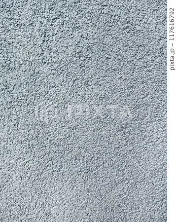 close-up texture shot of a rough, grey surface reminiscent of concrete or stucco. The granular quality and uneven shade variation make it suitable for backgrounds, graphic design close-up texture shot of a rough, grey surface reminiscent of concrete or stucco. The granular quality and uneven shade variation make it suitable for backgrounds, graphic design 117616792