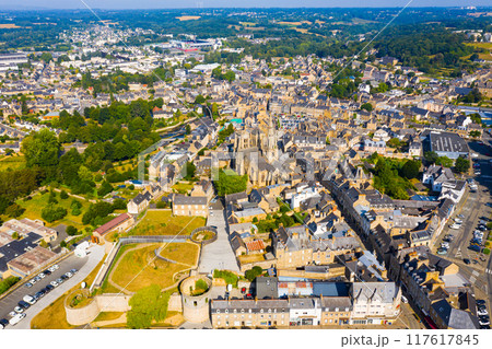 Flight over the city Guingamp and Basilica of Our Lady of Merciful on summer day 117617845