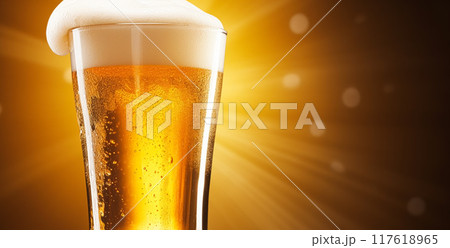 Glass of cold beer with foam, pint of original premium beer drink, alcohol flavour and holiday celebration idea 117618965