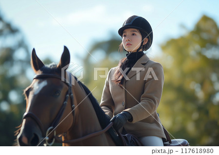 乗馬する女性 117618980