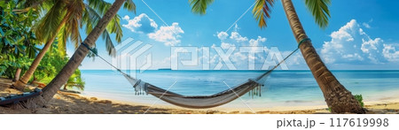 Hammock Between Palm Trees on Tropical Beach 117619998