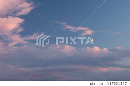Pink and blue sunset. Romantic dramatic background for design. Moon in sky and clouds.  117621537