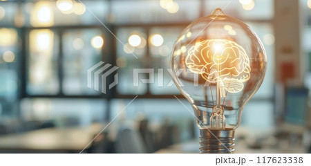 Lamp and blurred office. Lightbulb with mind. Genius brain and invention idea. Bright creativity solution and light electricity. Glowing electrical lamp. Blur room interior 117623338