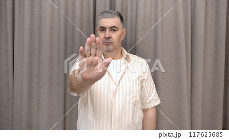 Man Showing STOP Gesture 117625685