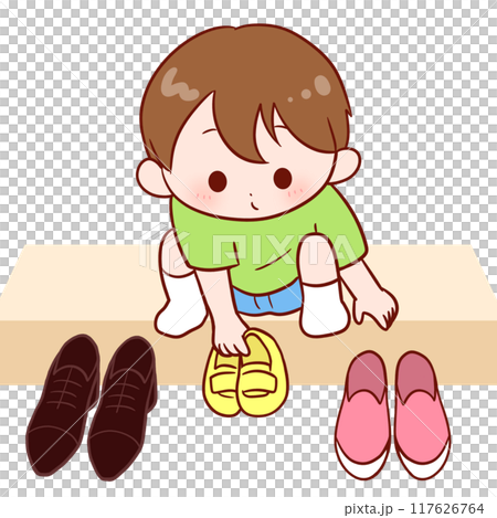 一個男孩把鞋子放在一起 117626764