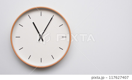 Minimalist wooden Wall Clock on White Wooden Surface with Space for Text. Time Set at 23.05/11.05 Minimalist wooden Wall Clock on White Wooden Surface with Space for Text. Time Set at 23.05/11.05 117627407
