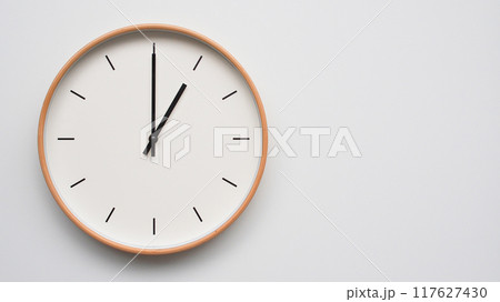 Minimalist wooden Wall Clock on White Wooden Surface with Space for Text. Time Set at 13.00/01.00 Minimalist wooden Wall Clock on White Wooden Surface with Space for Text. Time Set at 13.00/01.00 117627430
