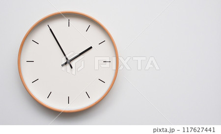 Minimalist wooden Wall Clock on White Wooden Surface with Space for Text. Time Set at 13.55/01.55 Minimalist wooden Wall Clock on White Wooden Surface with Space for Text. Time Set at 13.55/01.55 117627441