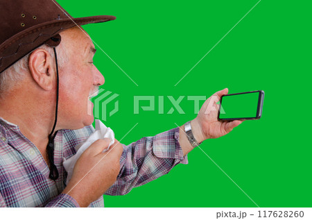 Old Man's Struggle with Distance: Arguing Over Video Call on Smartphone with Chroma Key Screen, Highlighting Rural and Urban Family Dynamics. Old Man's Struggle with Distance: Arguing Over Video Call on Smartphone with Chroma Key Screen, Highlighting Rural and Urban Family Dynamics. 117628260