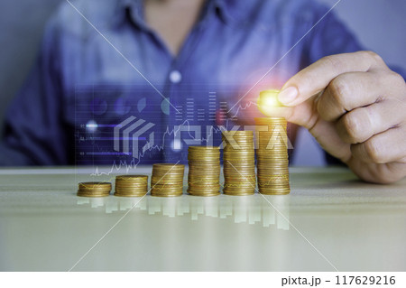 Coins are laid out in graph. Stack of the golden coin with a funding that grows. growing of business investment. growing power of compound interest concept. Business success wealth stock investment. Coins are laid out in graph. Stack of the golden coin with a funding that grows. growing of business investment. growing power of compound interest concept. Business success wealth stock investment. 117629216