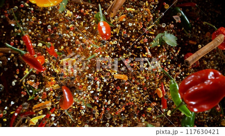 Freeze Motion Shot of Flying Mix Spices . Isolated on Black Background Freeze Motion Shot of Flying Mix Spices . Isolated on Black Background 117630421