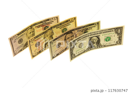 Denominations dollars of various denominations on a white background 117630747