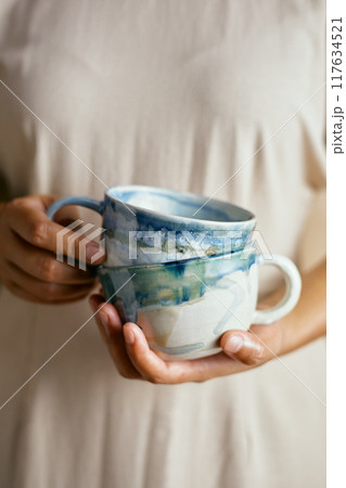 Female hands hold ceramic Female hands hold ceramic 117634521