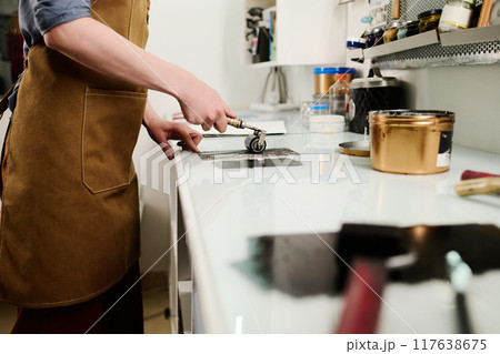 Young female designer working in studio Young female designer working in studio 117638675