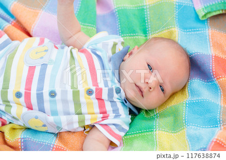 Little baby on colorful blanket 117638874