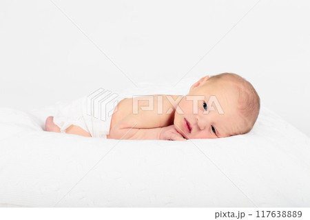 Newborn baby boy in hospital cot Newborn baby boy in hospital cot 117638889