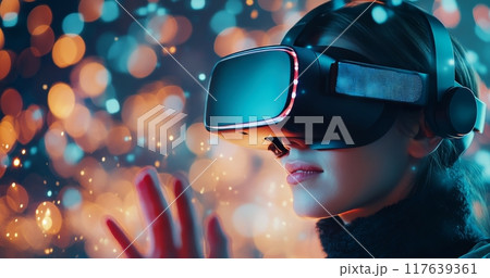 Person wearing virtual reality headset in colorful light display at night 117639361