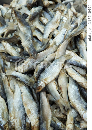 A large assortment of dried fish is on display in the Asian store. A large assortment of dried fish is on display in the Asian store. 117640494