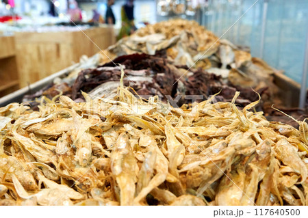 A large assortment of dried fish is on display in the Asian store. A large assortment of dried fish is on display in the Asian store. 117640500