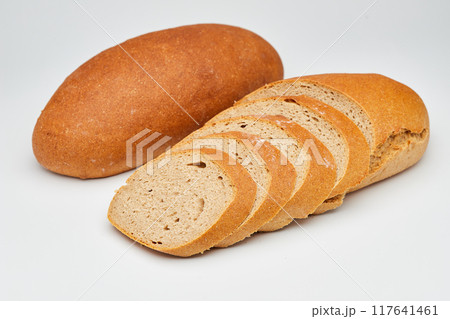 Whole wheat bread loaf sliced, showcasing its hearty texture and rich, wholesome flavor Whole wheat bread loaf sliced, showcasing its hearty texture and rich, wholesome flavor 117641461