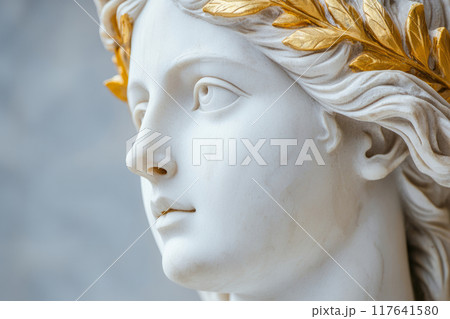 Antique statue of an attractive woman is wearing golden laurel wreath crown 117641580