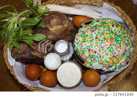 Colorful Easter Basket with Traditional Festive Foods 117641840