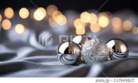 A silver and white ball is surrounded by other balls on a white background 117643627