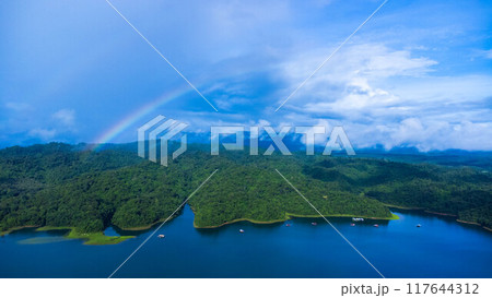 Aerial view of the River Kwai and floating houses in Kanchanaburi Province, Thailand. Beautiful view of floating cottages and and green forest along the River Kwai. 117644312