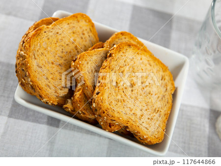 Sesame seed croutons served as appetizer 117644866