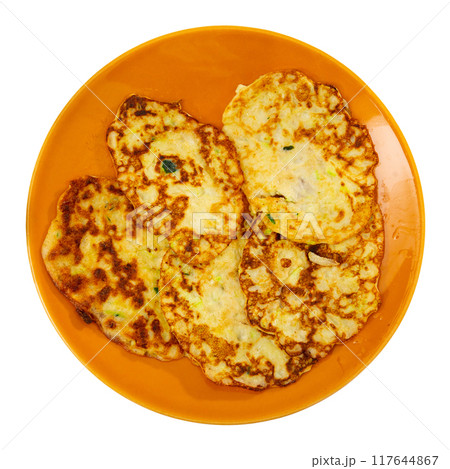 On plate are vegetable pancakes made from grated zucchini 117644867